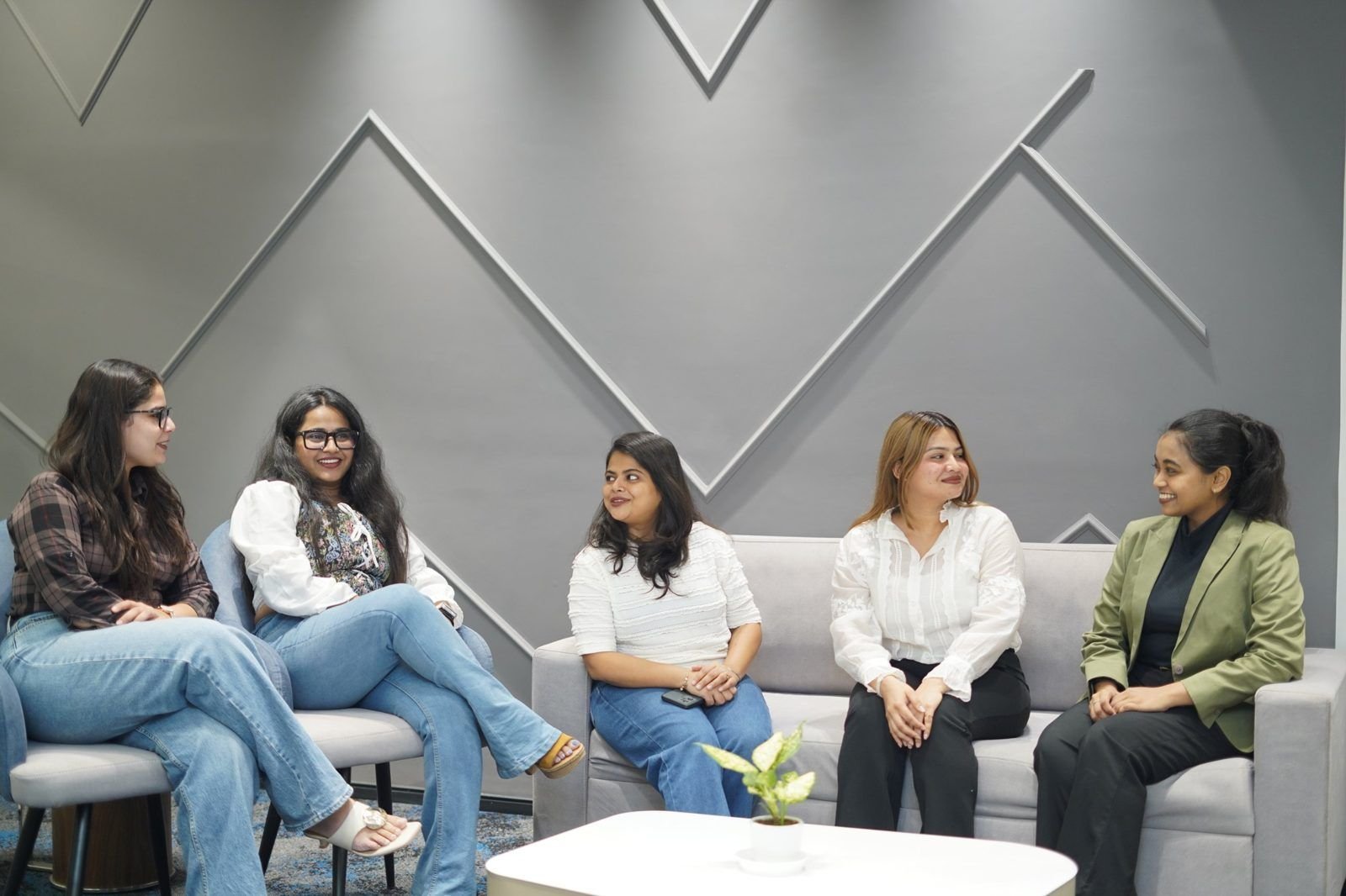 TNSL team members in conversation at the office